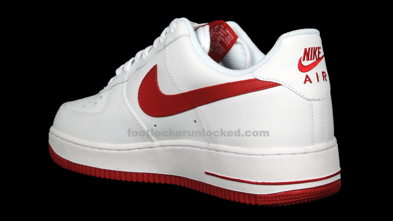 white nike shoes with red tick
